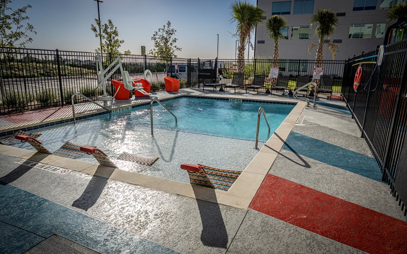 pool deck resurfacing with spray texture overlay